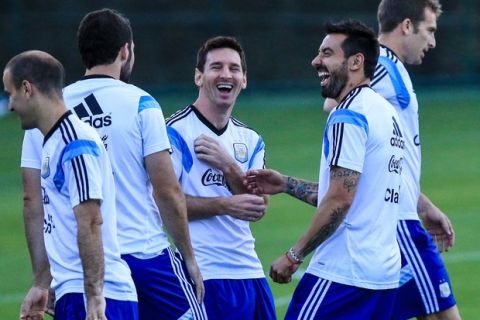 VESPASIANO, BRAZIL - JULY 06: Ezequiel Lavezzi and Lionel Messi during the Argentina training session at Cidade do Galo on July 6, 2014 in Vespasiano, Brazil. (Photo by Netun Lima/Getty Images)