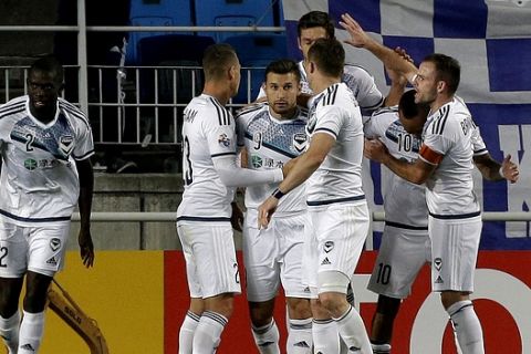Kosta Barbarouses, third from left, of Australia's Melbourne Victory is greeted by his teammates after scoring a goal against South Korea's Suwon Samsung Bluewings during their Group G soccer match in the AFC Champions League at Suwon World Cup Stadium in Suwon, South Korea, Wednesday, April 6, 2016. The game ended with a 1-1 draw. (AP Photo/Ahn Young-joon)