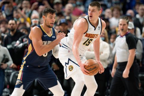 Denver Nuggets center Nikola Jokic, right, looks to drive past New Orleans Pelicans center Willy Hernangomez in the second half of an NBA basketball game Sunday, March 6, 2022, in Denver. The Nuggets won 138-130 in overtime. (AP Photo/David Zalubowski)












