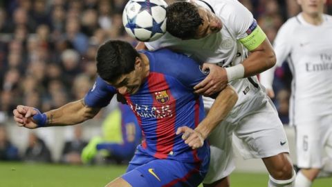 Barcelona's Luis Suarez, left, challenges for the ball with PSG's Thiago Silva during the Champions League round of 16, second leg soccer match between FC Barcelona and Paris Saint Germain at the Camp Nou stadium in Barcelona, Spain, Wednesday March 8, 2017. (AP Photo/Emilio Morenatti)