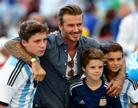 RIO DE JANEIRO, BRAZIL - JULY 13:  Former England international David Beckham and sons Brooklyn Beckham (L), Cruz Beckham (2nd R) and Romeo Beckham (R) prior to the 2014 FIFA World Cup Brazil Final match between Germany and Argentina at Maracana on July 13, 2014 in Rio de Janeiro, Brazil.  (Photo by Michael Steele/Getty Images)