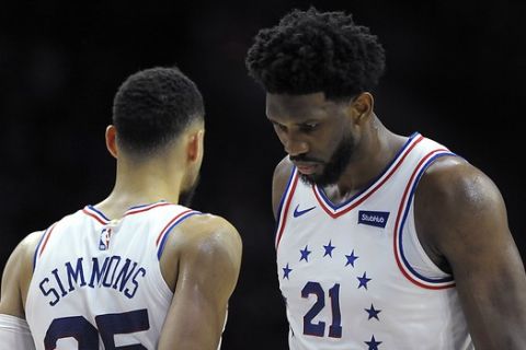 Philadelphia 76ers' Joel Embiid (21) and Ben Simmons are seen during an NBA basketball game against the Oklahoma City Thunder, Saturday, Jan. 19, 2019, in Philadelphia. (AP Photo/Michael Perez)