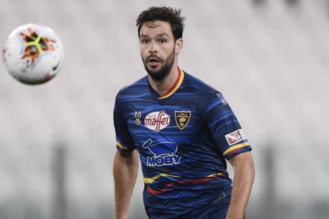 Lecce's Yevgen Shakhov in action during the Serie A soccer match between Juventus and Lecce, at the Allianz Stadium in Turin, Italy, Friday, June 26, 2020. (Fabio Ferrari/LaPresse via AP)
