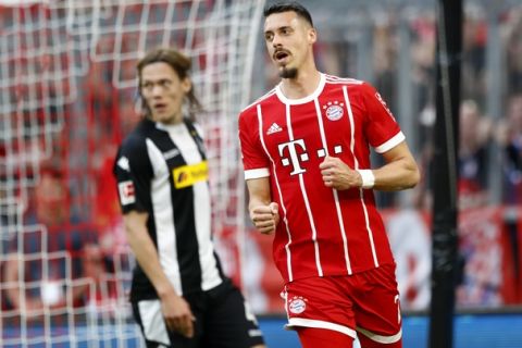 Bayern's Sandro Wagner celebrates after scoring his side's opening goal during the German Bundesliga soccer match between FC Bayern Munich and Borussia Moenchengladbach in Munich, Germany, Saturday, April 14, 2018. (AP Photo/Matthias Schrader)