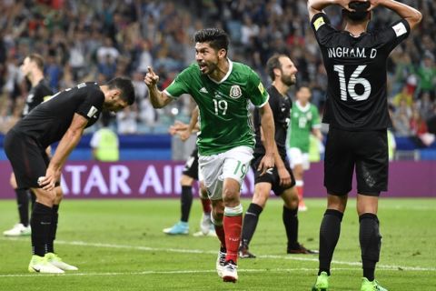 Mexico's Oribe Peralta celebrates after scoring his side's second goal during the Confederations Cup, Group A soccer match between Mexico and New Zealand, at the Fisht Stadium in Sochi, Russia, Wednesday, June 21, 2017. (AP Photo/Martin Meissner)