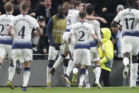 Tottenham's Son Heung-min, second from right, celebrates with his teammate after scoring during the Champions League, round of 8, first-leg soccer match between Tottenham Hotspur and Manchester City at the Tottenham Hotspur stadium in London, Tuesday, April 9, 2019. (AP Photo/Frank Augstein)