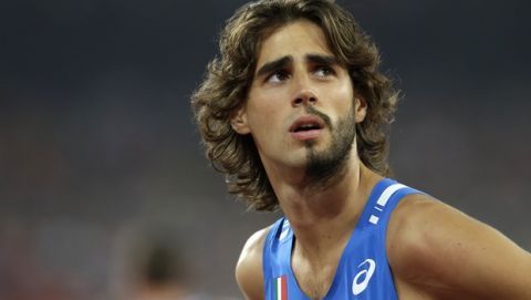 Italy's Gianmarco Tamberi prepares to compete in the men's high jump final at the World Athletics Championships at the Bird's Nest stadium in Beijing, Sunday, Aug. 30, 2015. (AP Photo/Kin Cheung) 