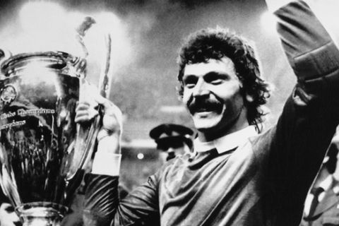 Jubilant Steaua Bucharest goalkeeper Helmuth Duckadam raises the European Champions Cup after the Romainian team defeated Barcelona in penalties in Seville, Spain on May 7, 1986. (AP Photo/Fernando Ricardo)