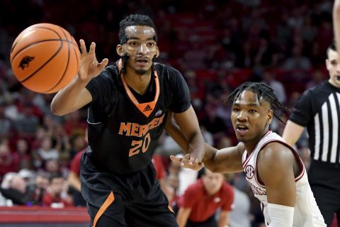 Arkansas guard JD Notae (1) puts pressure on Mercer guard Jalen Johnson (20) during the second half of an NCAA college basketball game Tuesday Nov. 9, 2021, in Fayetteville, Ark. (AP Photo/Michael Woods)