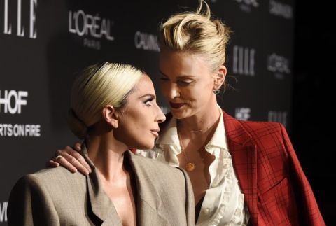 Lady Gaga, left, and actress Charlize Theron pose together on the carpet at the 25th Annual ELLE Women in Hollywood Celebration, Monday, Oct. 15, 2018, in Los Angeles. (Photo by Chris Pizzello/Invision/AP)