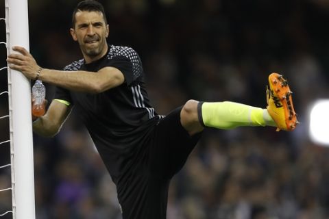 Juventus goalkeeper Gianluigi Buffon stretches before the Champions League final soccer match between Juventus and Real Madrid at the Millennium stadium in Cardiff, Wales Saturday June 3, 2017. (AP Photo/Frank Augstein)
