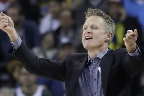 Golden State Warriors head coach Steve Kerr gestures during the first half of an NBA basketball game between the Warriors and the Utah Jazz in Oakland, Calif., Sunday, March 25, 2018. (AP Photo/Jeff Chiu)