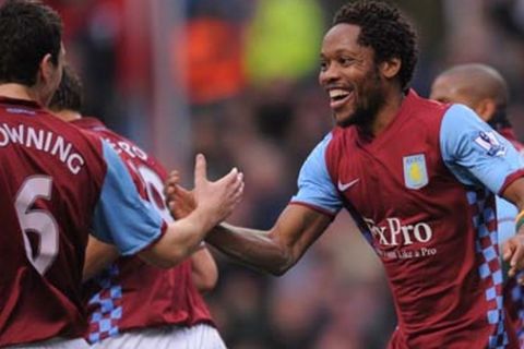 Aston Villa's Jean Makoun congratulates with Stewart Downing after creating the opening goal during the Barclays Premier League match at Villa Park, Birmingham.