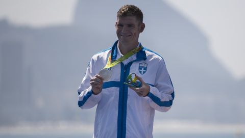 Spyridon Gianniotis, of Greece, holds the silver medal he won in the men's marathon swimming competition at the 2016 Summer Olympics in Rio de Janeiro, Brazil, Tuesday, Aug. 16, 2016. (AP Photo/Felipe Dana)