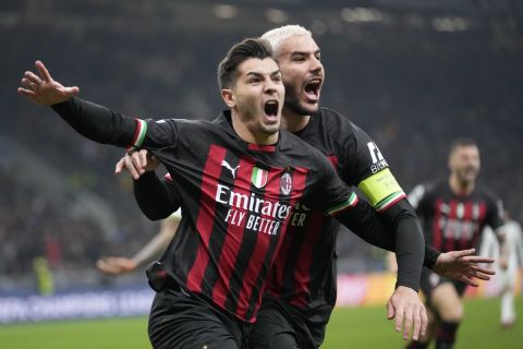 AC Milan's Brahim Diaz, left, celebrates after scoring his side's opening goal during the Champions League, round of 16, first leg soccer match between AC Milan and Tottenham Hotspur at the San Siro stadium in Milan , Italy, Tuesday, Feb. 14, 2023. (AP Photo/Luca Bruno)