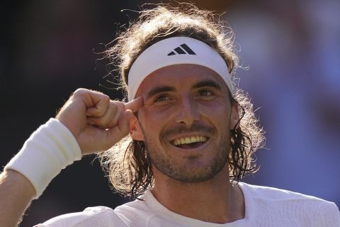 Stefanos Tsitsipas of Greece reacts after beating Britain's Andy Murray in a men's singles match on day five of the Wimbledon tennis championships in London, Friday, July 7, 2023. (AP Photo/Alberto Pezzali)