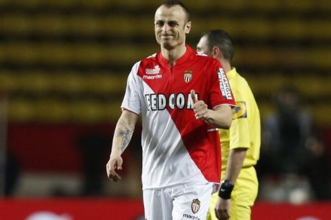 Monaco's Bulgarian forward Dimitar Berbatov celebrates after scoring a goal during the French L1 football match between AS Monaco and Sochaux at the "Louis II Stadium" in Monaco on March 9, 2014.  AFP PHOTO / VALERY HACHE        (Photo credit should read VALERY HACHE/AFP/Getty Images)
