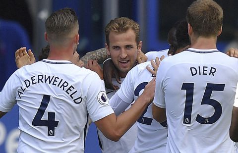 Tottenham Hotspur's Harry Kane, centre, celebrates scoring his side's first goal of the game with teammates, during the English Premier League soccer match between Everton and Tottenham Hotspur, at Goodison Park, in Liverpool, England, Saturday Sept. 9, 2017. (Dave Howarth/PA via AP)