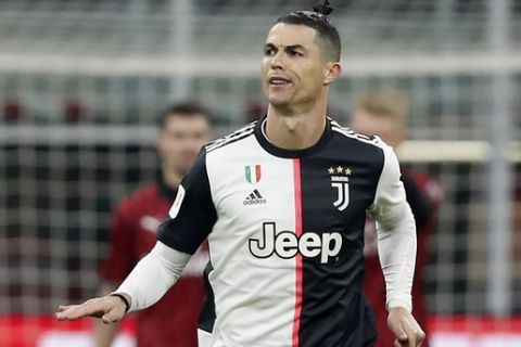 Juventus' Cristiano Ronaldo celebrate after scores with penalty against AC Milan during an Italian Cup soccer match between AC Milan and Juventus at the San Siro stadium, in Milan, Italy, Thursday, Feb. 13, 2020. (AP Photo/Antonio Calanni)