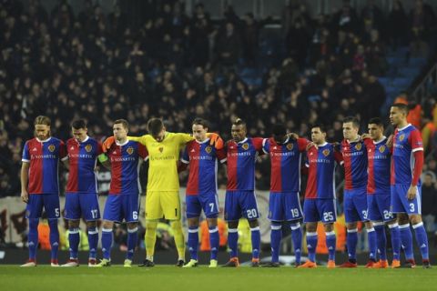 Basel players observe a minute of silence in memory of Fiorentina captain Davide Astori has died in his sleep on Sunday, prior to the start of the Champions League, round of 16, second leg soccer match between Manchester City and Basel at the Etihad Stadium in Manchester, England, Wednesday, March 7, 2018. (AP Photo/Rui Vieira)