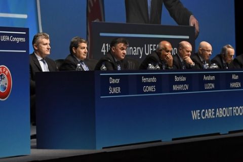FIFA President Gianni Infantino, left, speaks  during The 41st Ordinary UEFA Congress on Wednesday April  5, 2017  in Helsinki, Finland on Wednesday April  5, 2017. (Markku Ulander/Lehtikuva via AP)