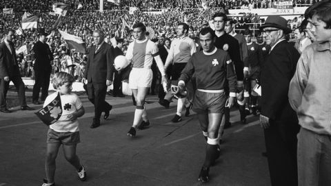The captains lead out the two teams for the start of the Final of the European Football Champion Club's Cup between Panathinaikos of Greece and Ajax of Amsterdam. Ajax defeated the Greek team 2-0 at Wembley Stadium, London, on June 2, 1971. (AP Photo)