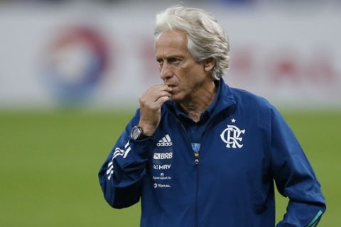 Flamengo's coach Jorge Jesus gestures before the Rio de Janeiro state championship final soccer match at the Maracana stadium, Rio de Janeiro, Brazil, Wednesday, July 15, 2020. The match is being played without spectators to curb the spread of COVID-19. (AP Photo/Leo Correa)