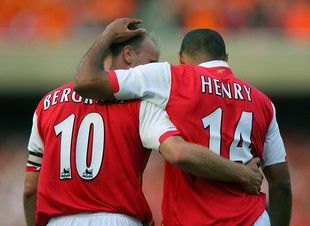 LONDON, UNITED KINGDOM:  Thierry Henry (R) of Arsenal celebrates scoring against Ajax with teammate Dennis Bergkamp during a pre season "Dennis Bergkamp" testimonial match at Emirates stadium in north London, 22 July 2006. The match played in honour of Arsenal's Dutch player Dennis Bergkamp who has served the club for 11 years and will retire after the game is the first match played at the club's new stadium. AFP PHOTO / ODD ANDERSEN  (Photo credit should read ODD ANDERSEN/AFP/Getty Images)