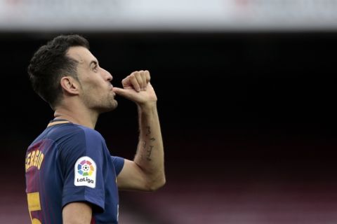 Barcelona's Sergio Busquets celebrates his goal during the Spanish La Liga soccer match between Barcelona and Las Palmas at the Camp Nou stadium in Barcelona, Spain, Sunday, Oct. 1, 2017. Barcelona's Spanish league game against Las Palmas is played without fans amid the controversial referendum on Catalonia's independence. (AP Photo/Manu Fernandez)