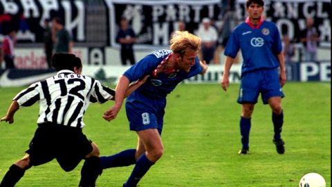 Croatian soccer player Robert Prosinecki, right, leads the ball passing by Trobok from Partizan during qualification round for the European Champions Cup in Belgrade, Wednesday July 23,1997. This is the first match after six years between two rivals. Partizan won the first-leg match by 1:0. (AP PHOTO/STR)