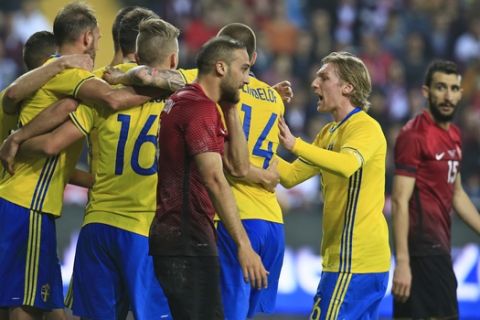 Sweden's players celebrate with their captain Andreas Granqvist, left, after he scored against Turkey, during a friendly international soccer match in Antalya, Turkey, Thursday, March 24, 2016. (AP Photo/Lefteris Pitarakis)