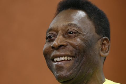 FILE - In this March 20, 2015 file photo, Brazilian soccer legend Pele smiles during a media opportunity at a restaurant in London. Pele said on Friday, Aug. 5, 2016 that his poor health will keep him from attending the opening ceremony of the Rio Olympics.  (AP Photo/Kirsty Wigglesworth, File)