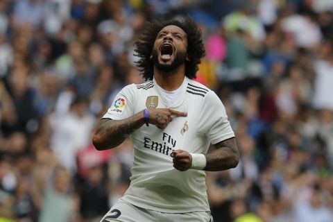 Real Madrid's Marcelo celebrates after scoring his side's 1st goal during a Spanish La Liga soccer match between Real Madrid and Levante at the Santiago Bernabeu stadium in Madrid, Spain, Saturday, Oct. 20, 2018. (AP Photo/Paul White)