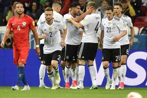 German players celebrate after Germany's Lars Stindl scored his side's opening goal during the Confederations Cup, Group B soccer match between Germany and Chile, at the Kazan Arena, Russia, Thursday, June 22, 2017. (AP Photo/Martin Meissner)