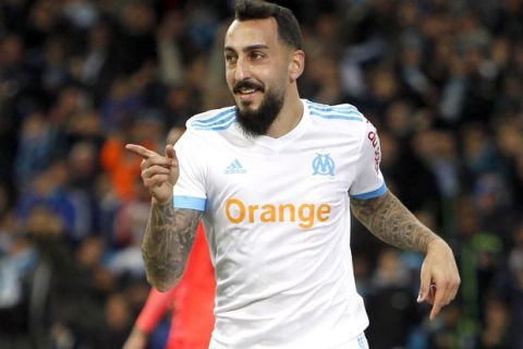 Marseille's Konstantinos Mitroglou gestures after scoring during the League One soccer match between Marseille and Caen, at the Velodrome stadium, in Marseille, southern France, Sunday, Nov. 5, 2017. (AP Photo/Claude Paris)