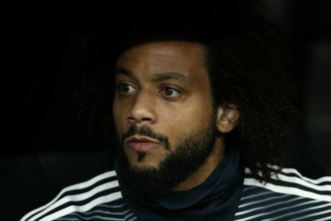 Real defender Marcelo takes a seat on the bench before the Spanish La Liga soccer match between Real Madrid and FC Barcelona at the Bernabeu stadium in Madrid, Saturday, March 2, 2019. (AP Photo/Manu Fernandez)