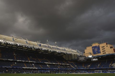 Dark clouds loom over Stamford Bridge stadium ahead of the English Premier League soccer match between Chelsea and Luton Town in London, Friday, Aug. 25, 2023. (AP Photo/Ian Walton)