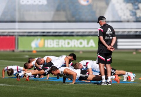 MADRID, SPAIN - AUGUST 07: Head coach Carlos Ancelotti of Real Madrid follows his players exercises during a training session at Valdebebas training ground on August 7, 2014 in Madrid, Spain. (Photo by Antonio Villalba/Real Madrid via Getty Images)