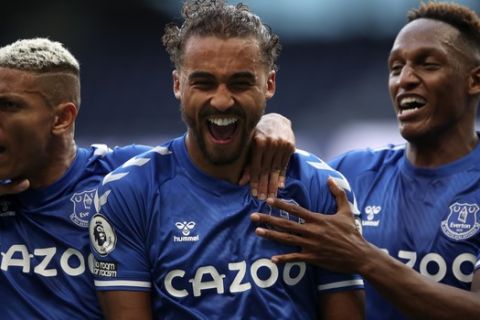 Everton's Dominic Calvert-Lewin, centre, celebrates with teammates after scoring his side's opening goal during the English Premier League soccer match between Tottenham Hotspur and Everton at the Tottenham Hotspur Stadium in London, Sunday, Sept. 13, 2020. (Alex Pantling/Pool via AP)