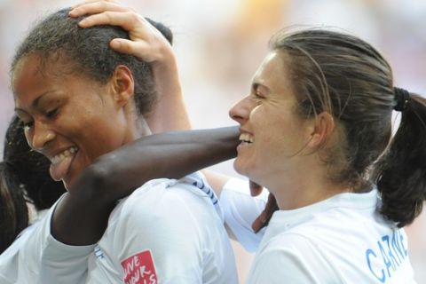 England's Rachel Yankey, left, celebrates scoring her side's second goal with England's Karen Carney, right, during the group B match between England and Japan at the Womens Soccer World Cup in Augsburg, southern Germany, on Tuesday, July 5, 2011. (AP Photo/Kerstin Joensson)