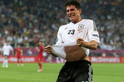 L'VIV, UKRAINE - JUNE 09:  Mario Gomez of Germany celebrates scoring their first goal during the UEFA EURO 2012 group B match between Germany and Portugal at Arena Lviv on June 9, 2012 in L'viv, Ukraine.  (Photo by Joern Pollex/Getty Images)