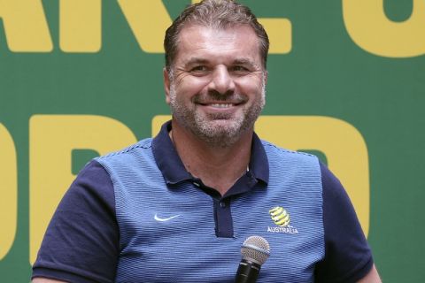 FILE  - In this Nov. 16, 2017, file photo Australian soccer team head coach Ange Postecoglou smiles during a reception following their qualification to the 2018 soccer World Cup in Sydney, Australia. Postecoglou has quit as Australia coach a week after the Socceroos secured a spot at next year's World Cup with an intercontinental win over Honduras. (AP Photo/Rick Rycroft, File)