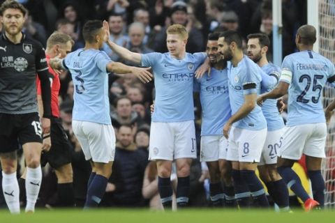 Manchester City's players celebrate after scoring their side's opening goal during the English Premier League soccer match between Manchester City and Burnley at Etihad stadium in Manchester, England, Saturday, Jan. 26, 2019. (AP Photo/Rui Vieira)