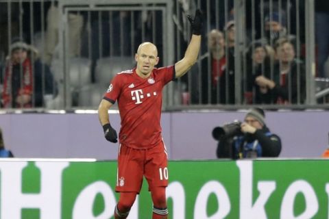 Bayern midfielder Arjen Robben celebrates after scoring the opening goal during the Champions League group E soccer match between FC Bayern Munich and Benfica Lisbon in Munich, Germany, Tuesday, Nov. 27, 2018. (AP Photo/Matthias Schrader)