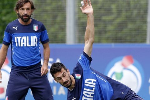 Italy's Davide Astori, right, and Andrea Pirlo attend a training session of the Italian national team ahead of Friday's Euro 2016 soccer match against Croatia, at the Coverciano training center, near Florence, Italy, Wednesday, June 10, 2015. (AP Photo/Fabrizio Giovannozzi)