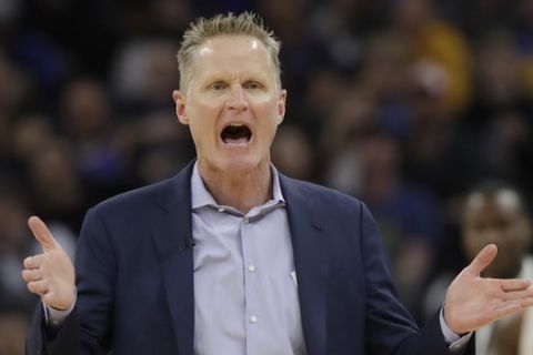 Golden State Warriors head coach Steve Kerr gestures toward an official during the first half of his team's NBA basketball game against the Toronto Raptors in San Francisco, Thursday, March 5, 2020. (AP Photo/Jeff Chiu)