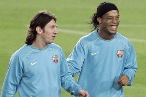 FC Barcelona players Lionel Messi, from Argentina, left, and Ronaldinho, from Brazil, attend a training session at Nou Camp Sdium in Barcelona, Spain, Tuesday, Nov. 6, 2007. FC Barcelona will play against Rangers FC on Wednesday, Nov. 7, in a Group E Champions League in Barcelona. (AP Photo/Manu Fernandez)