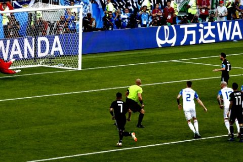 Iceland goalkeeper Hannes Halldorsson saves a penalty attempt by Argentina's Lionel Messi during the group D match between Argentina and Iceland at the 2018 soccer World Cup in the Spartak Stadium in Moscow, Russia, Saturday, June 16, 2018. (AP Photo/Rebecca Blackwell)
