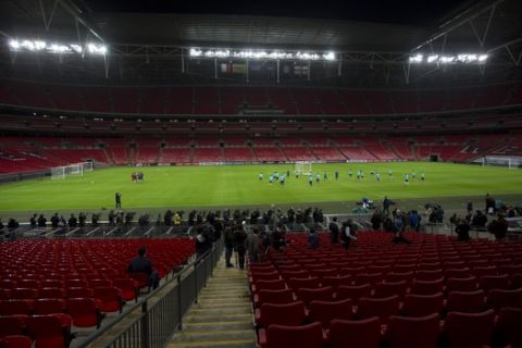 French national soccer team players take part in a training session at Wembley Stadium in London, Monday, Nov. 16, 2015. Three days after being caught up in a synchronized terrorist attack in Paris that resulted in the death of over 120 people, Frances players have travelled to London to play a friendly soccer match against England at Wembley Stadium, where there will be a beefed-up security presence and increased checks outside the ground. (AP Photo/Matt Dunham)