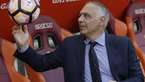 FILE - In this Sunday, May 28, 2017 file photo AS Roma president James Pallotta plays with a ball prior to an Italian Serie A soccer match between Roma and Genoa at the Olympic stadium in Rome, Sunday, May 28, 2017. A "Made in USA" matchup. The "American derby." Italian media are promoting Friday's match between AC Milan and Roma at the San Siro stadium as the first meeting of two American-owned clubs in Serie A. (AP Photo/Alessandra Tarantino, File)